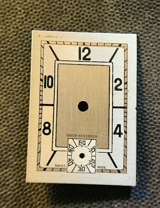 Original Shock Absorber (Helvetia) - Art Deco Zifferblatt - L = 24,2mm X B = 17,2mm - für Helvetia Cal. 75 - 1930er Jahre
