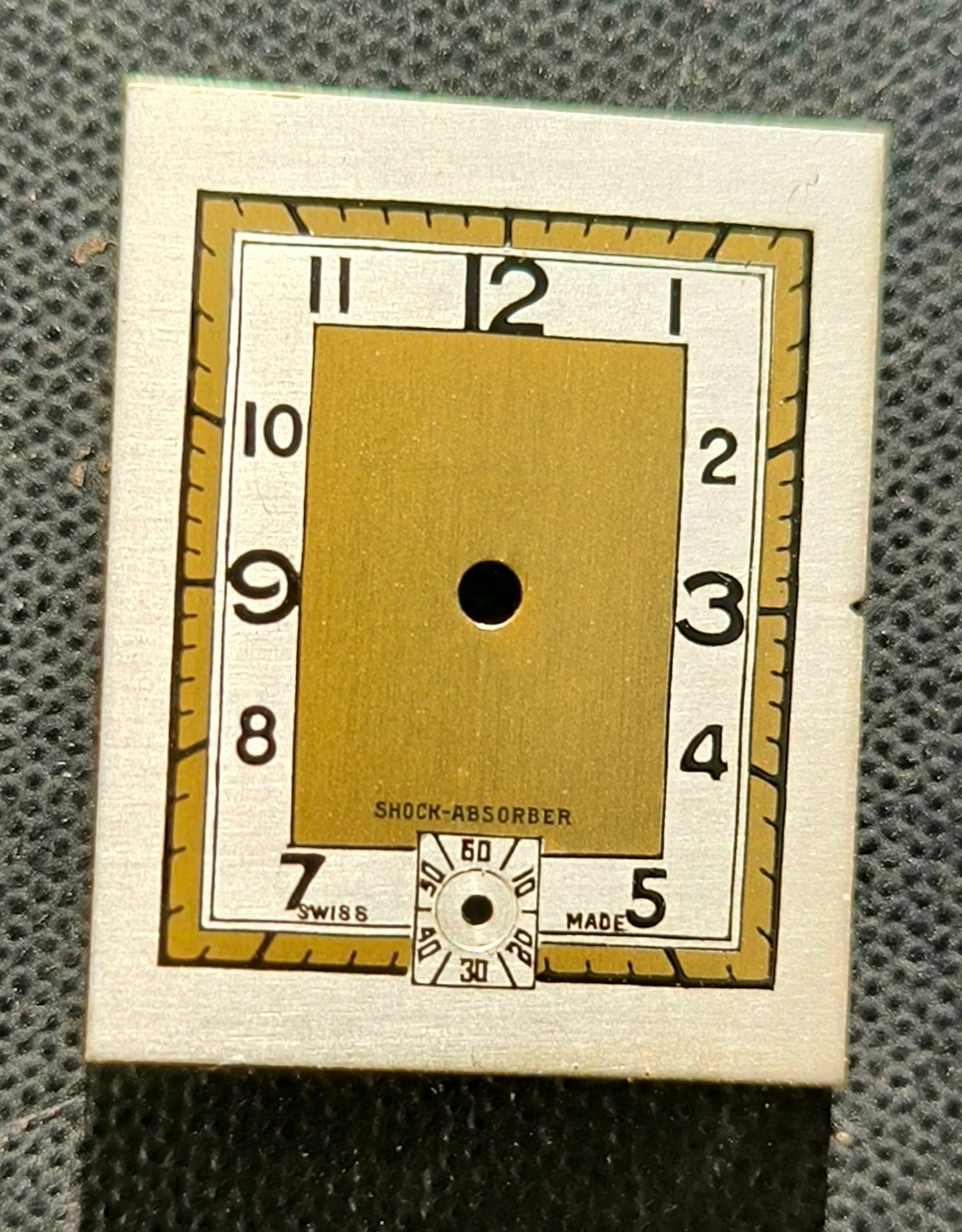 Helvetia Shock Absorber - NOS - Art Deco Zifferblatt - L = 23,8mm X B = 18,9mm - für Helvetia Cal. 75 - 1930er Jahre