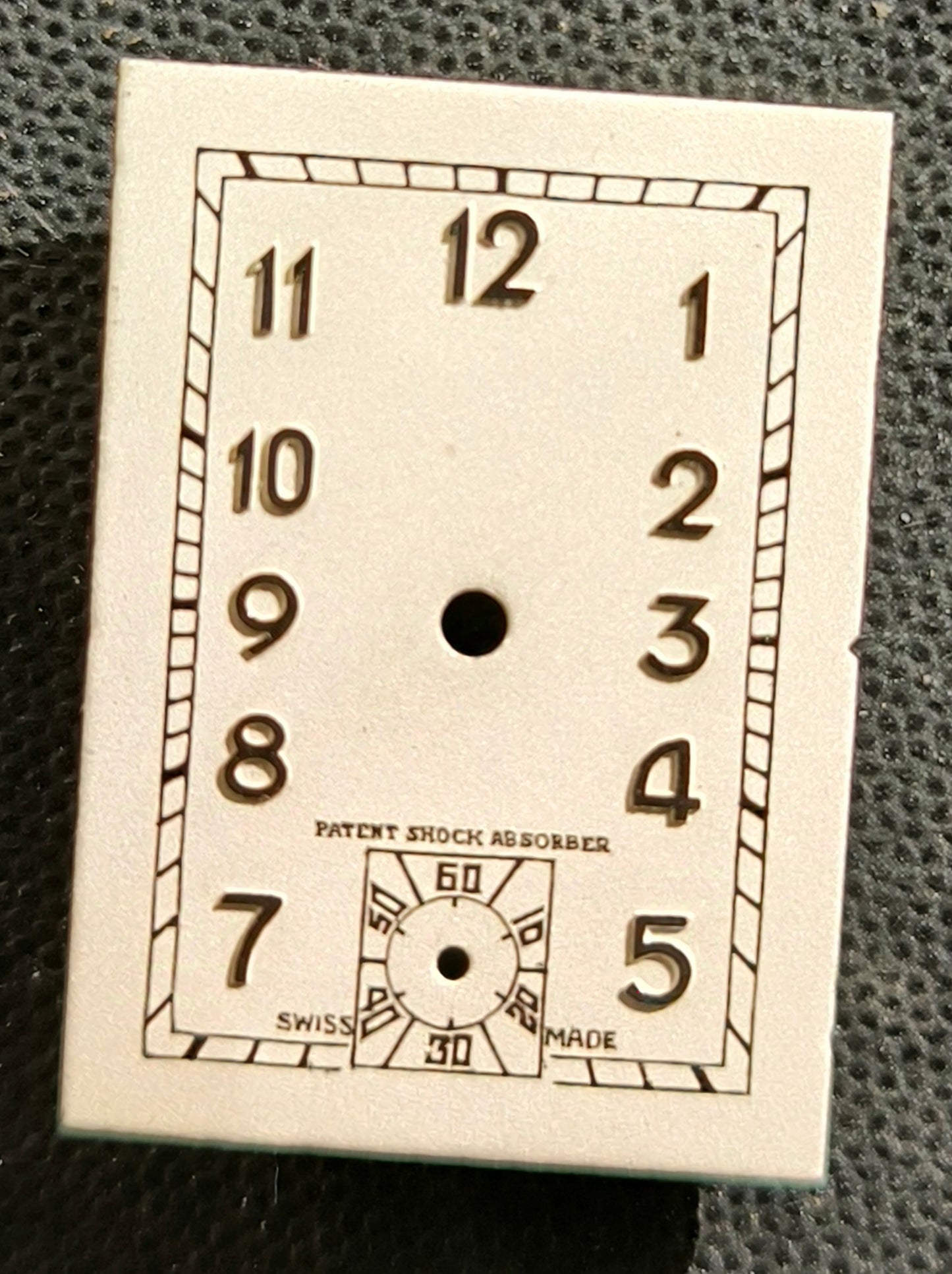 Patent Shock Absorber (Helvetia) - NOS - Art Deco Zifferblatt - L = 24,8mm X B = 17,6mm - für Helvetia Cal. 75 - 1930er Jahre